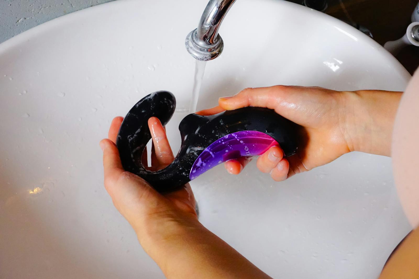 A Person Holding a Sex Toy